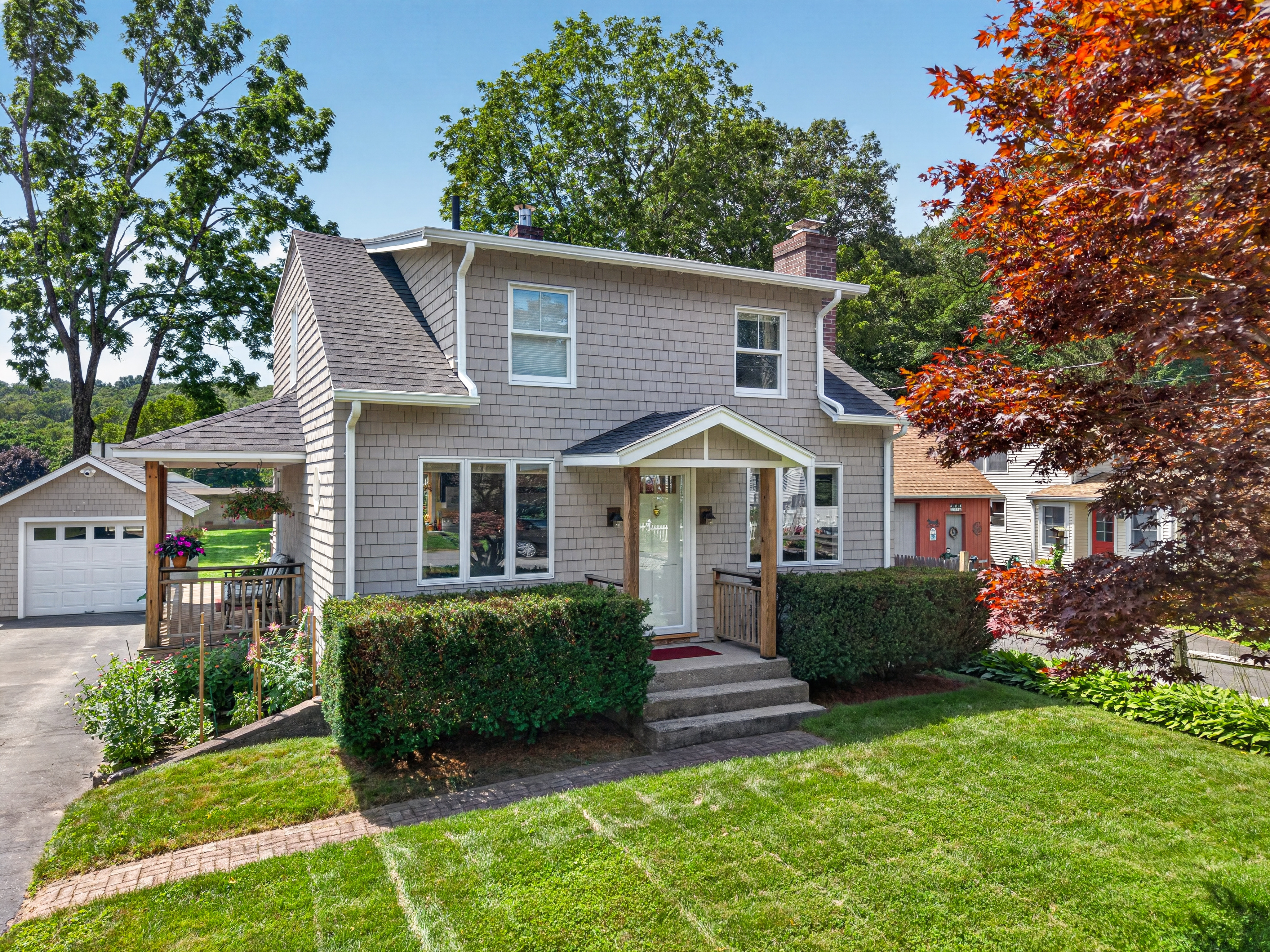 Front exterior of 16 Quaker Lane, a Cape Cod-style home in Quaker Hill, Connecticut